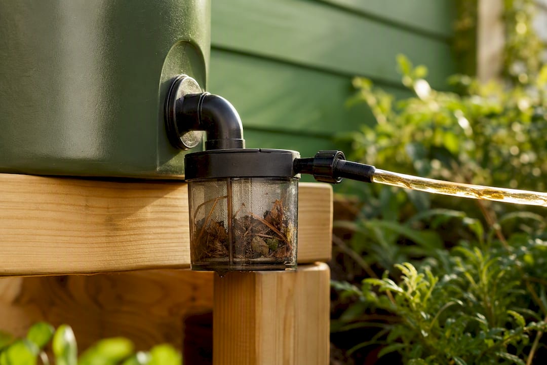 Coarse pre-filter on rain barrel irrigation outlet