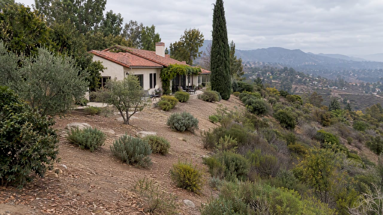 Foothill home beside a cleared brush perimeter